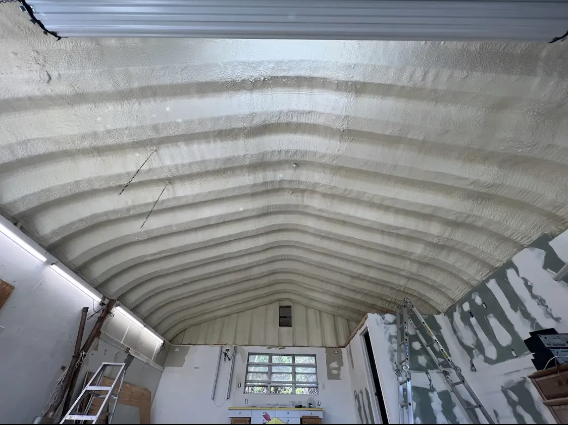 Spray polyurethane foam applied to the underside of a metal roof deck in Shelbyville